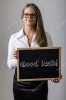 depositphotos_91637236-stock-photo-good-luck-young-businesswoman-holding.jpg