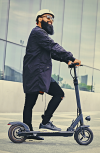 Happy-man-riding-a-Bullet-Stealth-electric-scooter.png