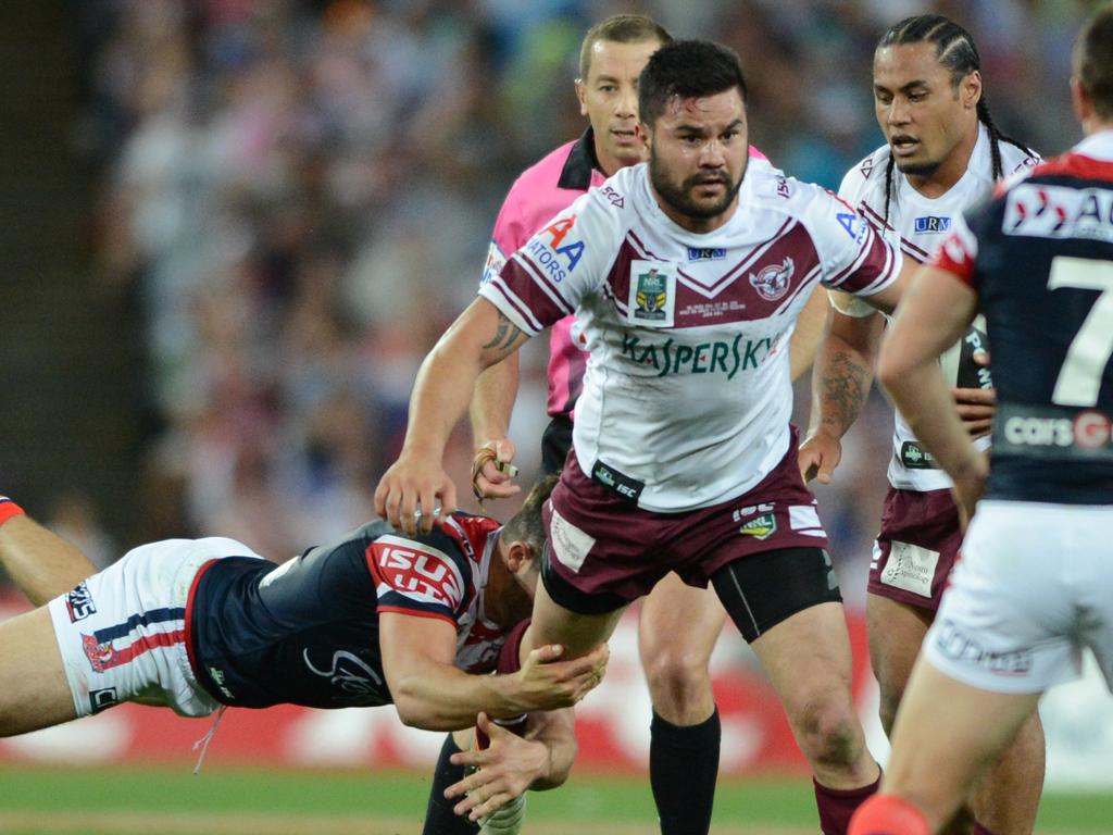 Horo pushes through a Roosters tackle during the 2013 NRL Grand Final. Pic: (AAP Image/Dean Lewins)