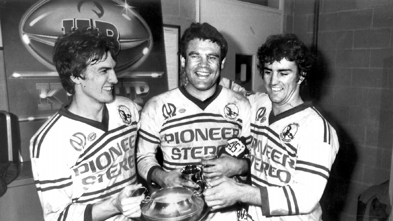 Manly RL players (L-R) Mike Eden, Graham Eadie and Michael Blake with a trophy in 1982.