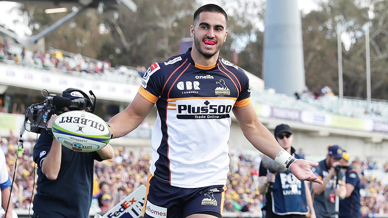 Tom Wright celebrates scoring a try for the Brumbies